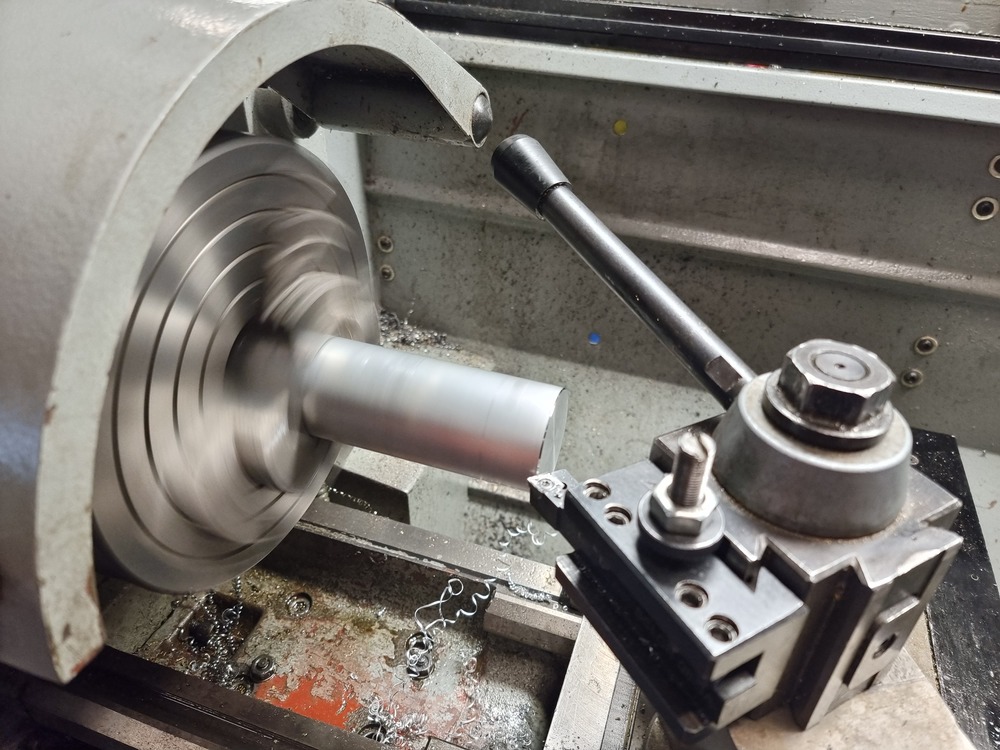 aluminum stock spinning in the lathe