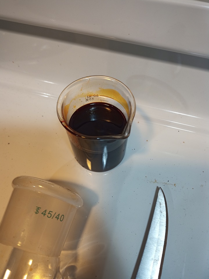 dark red pepper extract in beaker