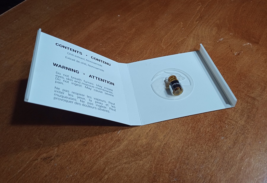 bottle inside paper cover, perspective view