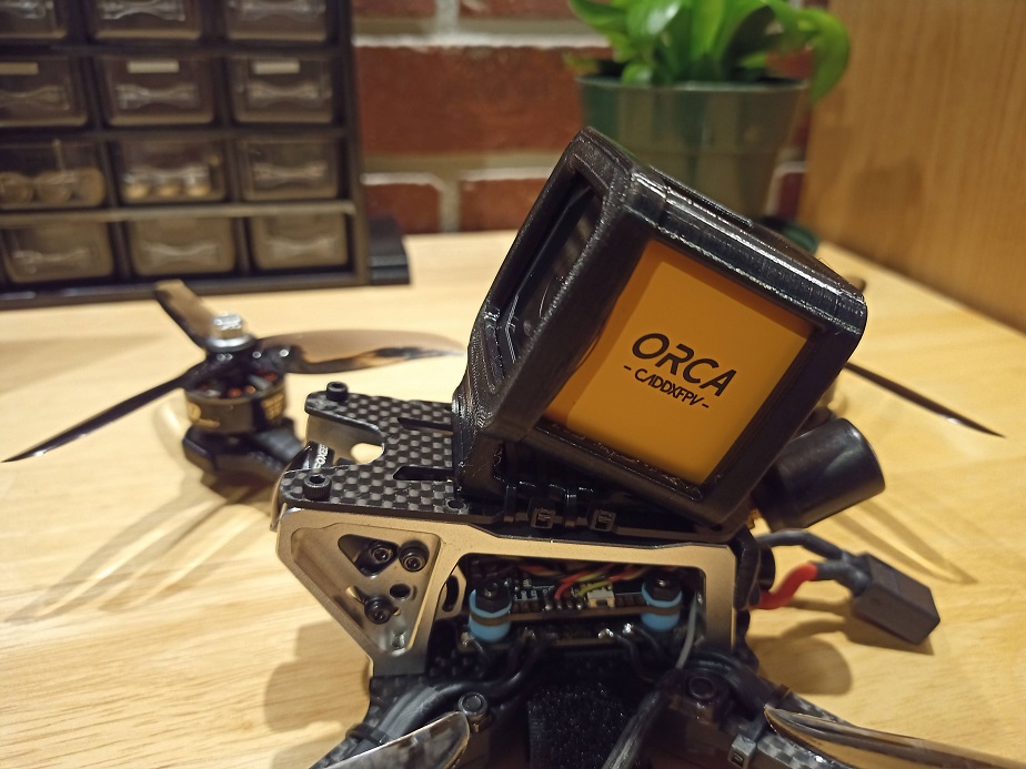 close up of caddx orca mounted on drone