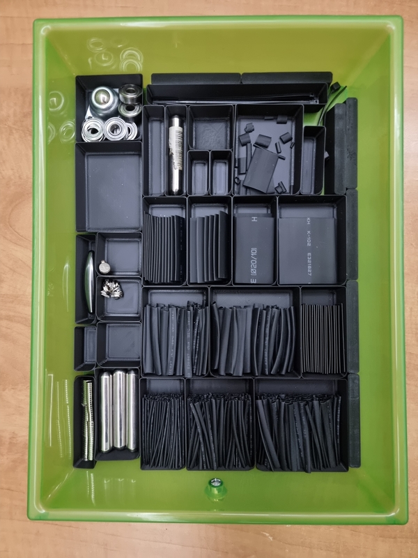drawer containing heat shrink and magnets